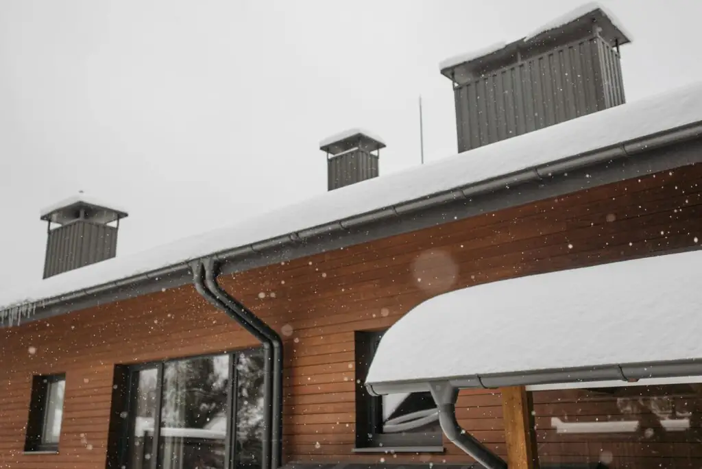 Brick house with gutters and downspouts